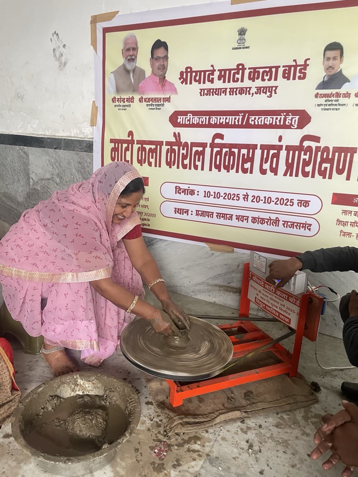 Kailash Devi demonstrating pottery wheel shaping during the Maati Kala Kaushal Vikas training camp