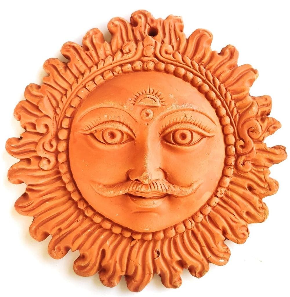Surya Dev terracotta medallion bringing auspicious light to homes, crafted in Molela