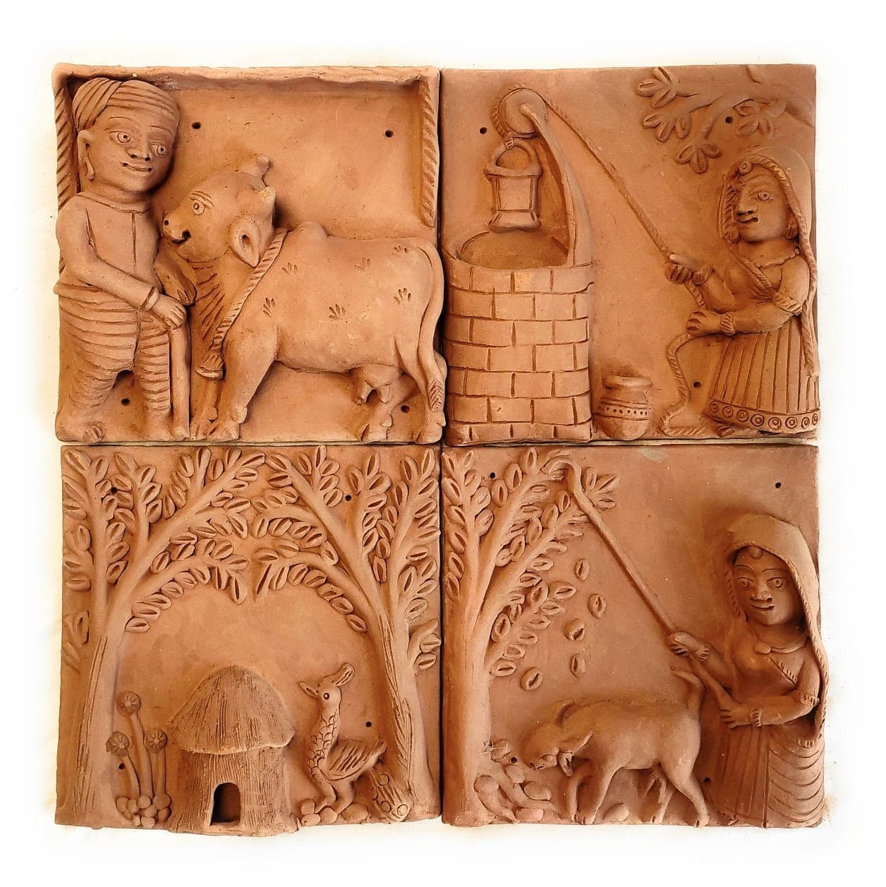 Miniature Molela clay tiles with hand-carved relief detail