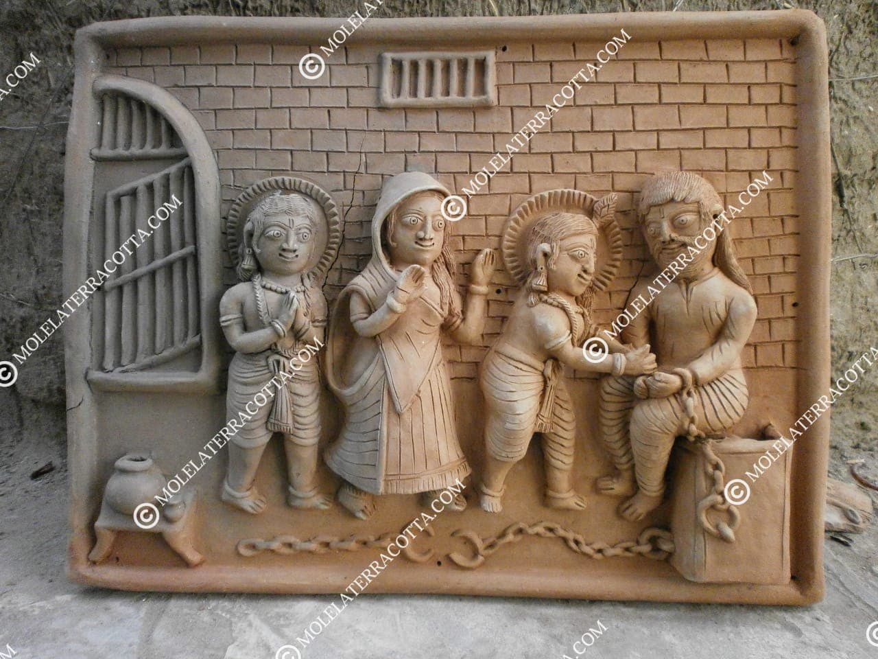 Molela terracotta wall decor tile showing Krishna freeing Devaki and Vasudeva from prison