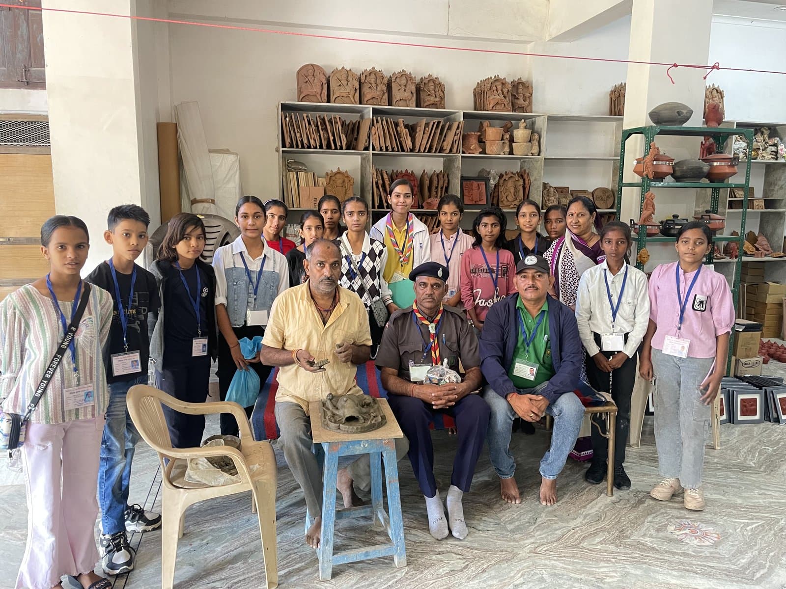 Dinesh Chandra Kumhar demonstrating terracotta sculpting in the studio masterclass with visiting students